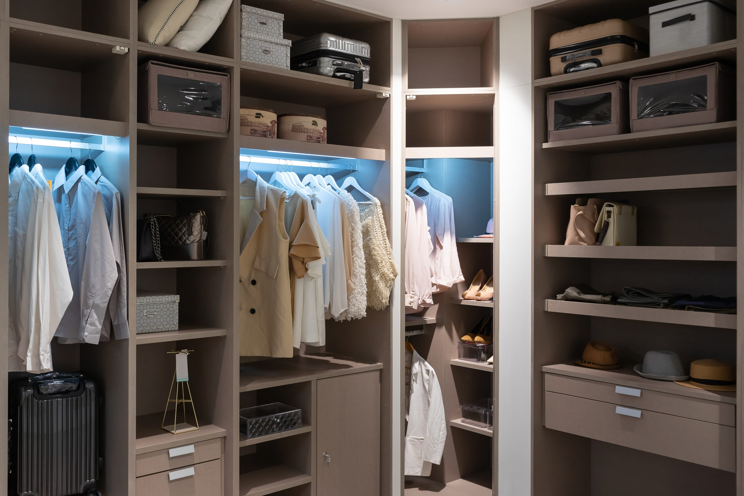 Beautifully organized walk in closet. closet design concept image